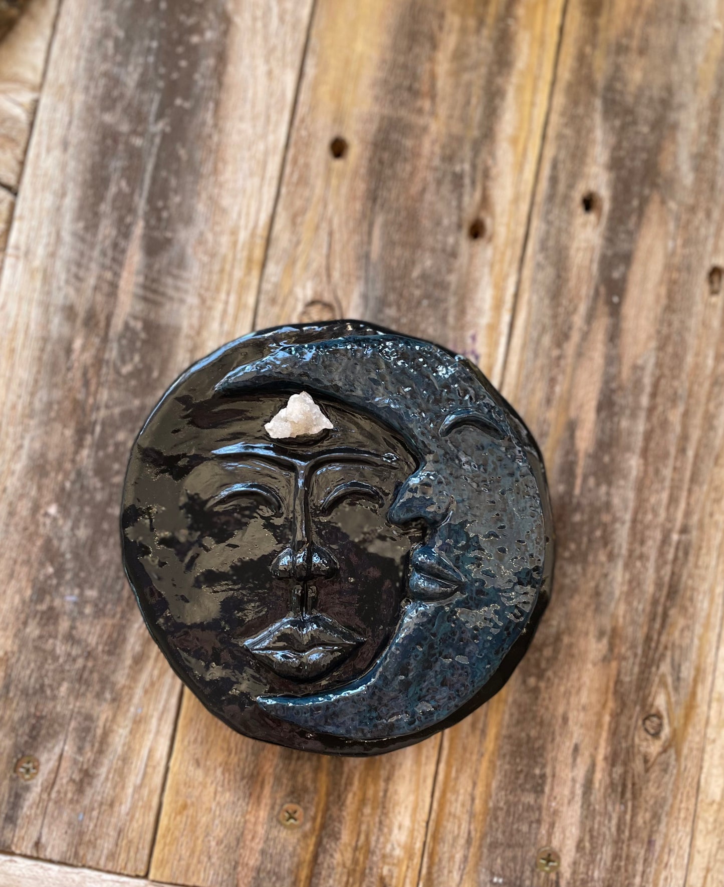 Moon face sculpture